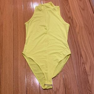 Forever 21 Yellow short sleeve Sipper in the front Bodysuit